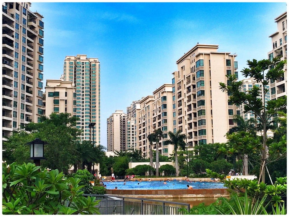 An apartment complex with a swimming pool to show apartment management