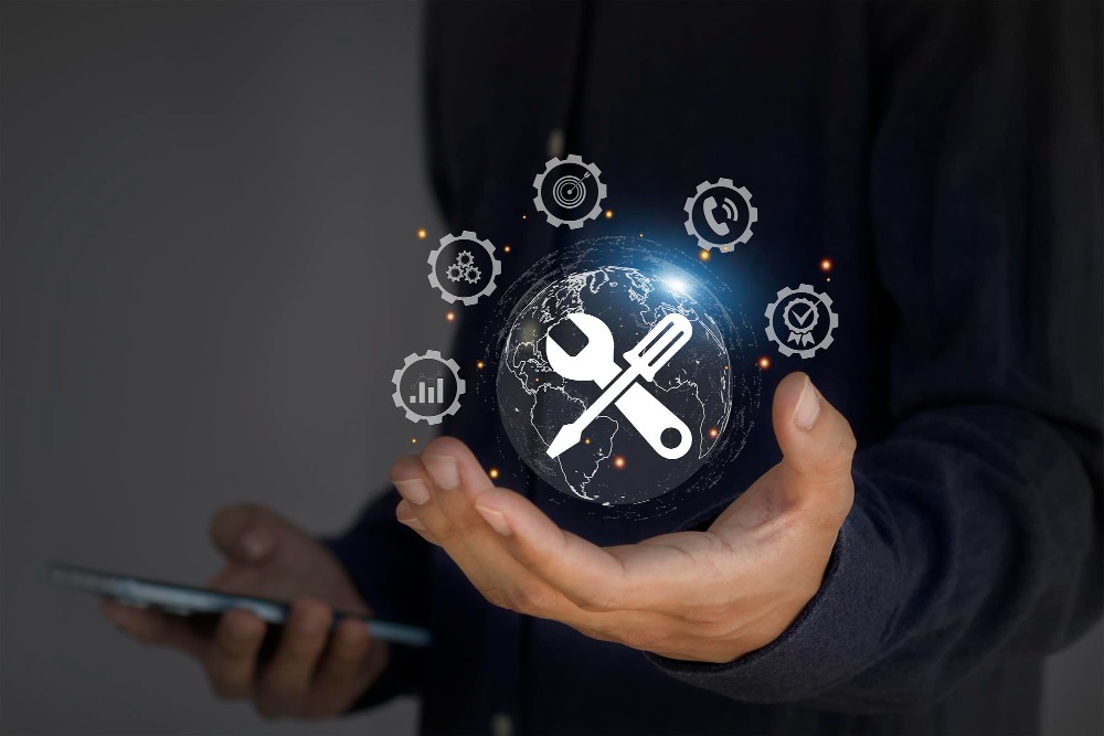 Man holding a virtual ball with screwdriver and spanner which denotes smart facility management